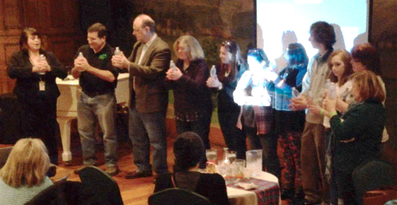 squeezing bottles in a group