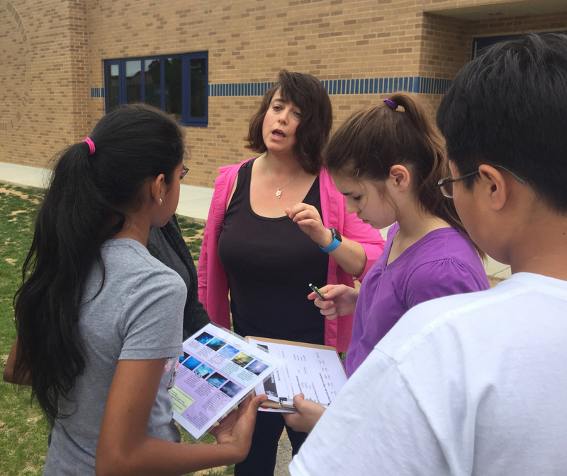 Earth Lady and students do field work.