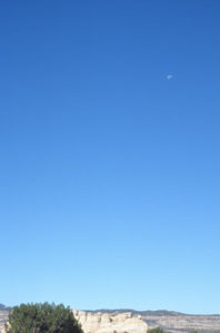The clarity of a crystal blue sky and waning crescent moon in New Mexico