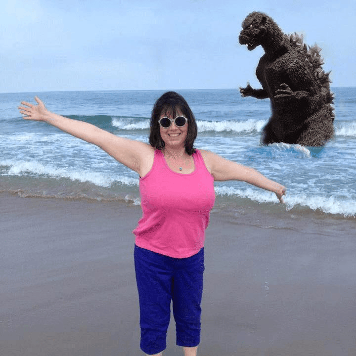 toes in the ocean with godzilla